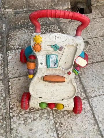 Used baby activity walker with play tray - needs cleaning