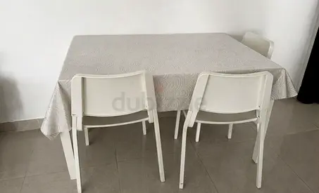 White dining table with 4 chairs - simple, good condition