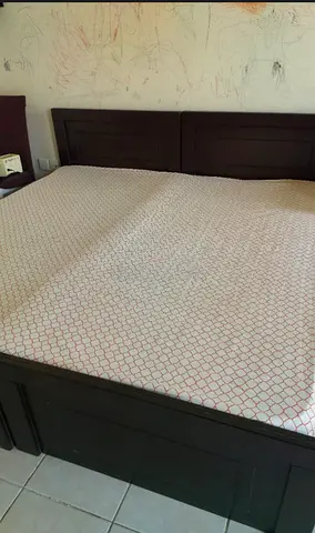 Dark wood double bed frame with headboard - good condition