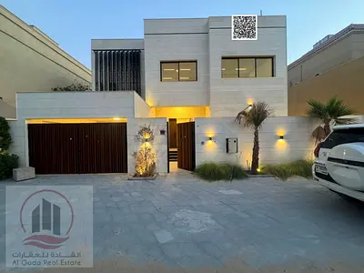 Villa for sale in Ajman Al Rawda, 5 master bedrooms, majlis, living room, and maid's room. Freehold ownership for all nationalities. Bank financing av