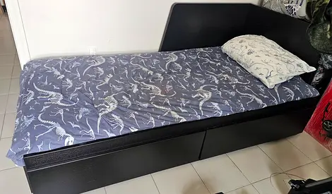 IKEA Single bed with under-bed storage, black wooden frame - good condition