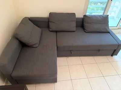 Gray L-shaped Sofa Bed with Storage — Good Condition