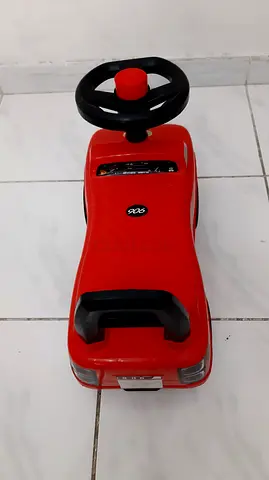 Red toddler ride-on push car with steering wheel