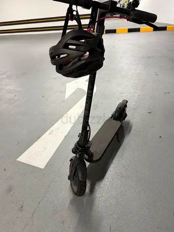 Black Electric Scooter with Helmet and Lock