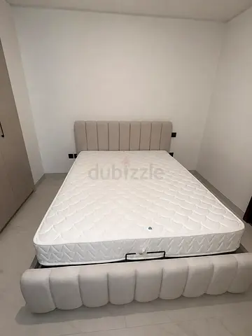 Queen upholstered bed frame with mattress - light beige
