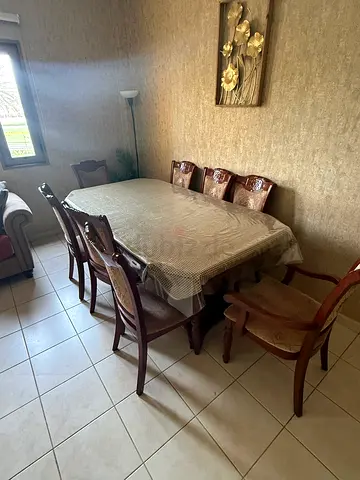 Wooden dining table with 8 chairs - good condition