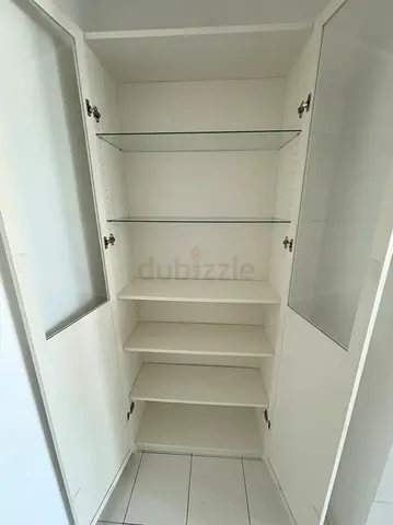 Ikea Billy - White Tall Cabinet with Glass Doors and Multiple Shelves