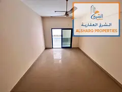 Two bedrooms and a living room, separate living room, two bathrooms, balcony, directly on Khalifa St