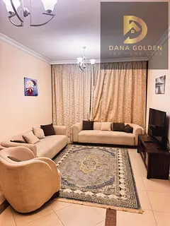 Furnished one-bedroom apartment with living room, two bathrooms, two balconies, and internet access
