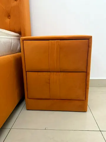 Orange upholstered bedside nightstand with 2 drawers