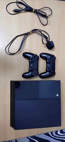 Sony PlayStation 4 Console with 2 Controllers and Cables - Good Working Condition
