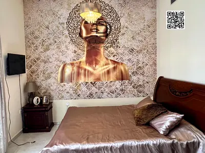 You own a two-bedroom apartment with a spacious living room in Lake Tower in UAE City.