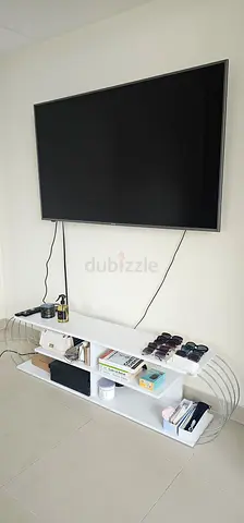 MOVE-OUT SALE! 65-inch Smart LED TV with Wall Mount and Large, White TV stand