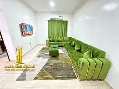 Furnished 2-bedroom apartment for monthly rent in Al Muwaihat 3. Includes utilities, internet, and p