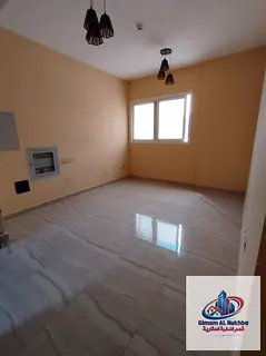 Second-occupancy 1BR in Al Nad, modern tower, central AC & free parking. AED 34K incl. parking.