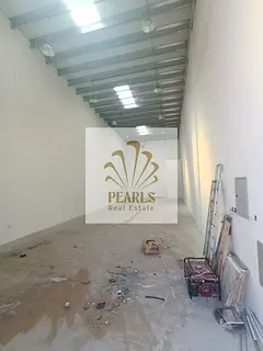 4 warehouses for annual rent in Al Jurf Industrial 2, 1,700 sq ft, 22 KW, 3-phase power, near Sheikh