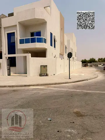 Townhouse for sale in Ajman, Al Helio area, including registration fees. 4 master bedrooms, living room, majlis, and hall. Freehold ownership for all