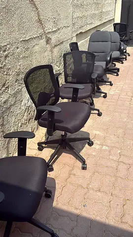 Lot of used black office swivel chairs - adjustable, mesh & fabric seats