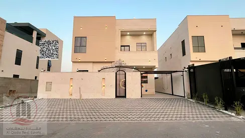 Villa for sale in Ajman, Al Bahia area. 6 master bedrooms with a roof terrace, majlis, living room, and maid's room. Freehold ownership available to a