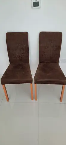 Pair of brown dining chairs with wooden legs - good condition