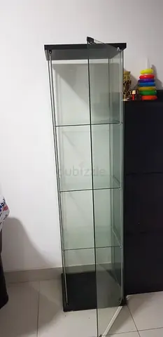 Tall glass display cabinet with shelves - good condition