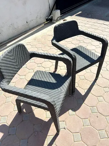 Set of 2 outdoor woven rattan armchairs — good condition