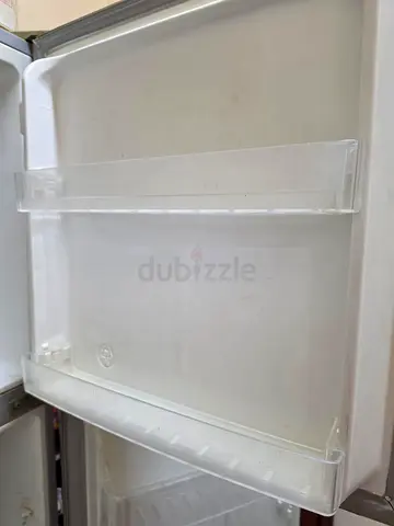 Used Single-Door Refrigerator — Interior Shelves Intact