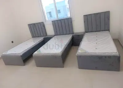 Brand New Three grey singles size beds with headboards With Medical Mattress