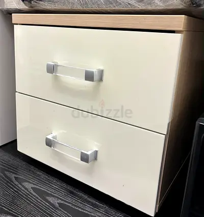 Light wood bedside cabinet with two glossy white drawers