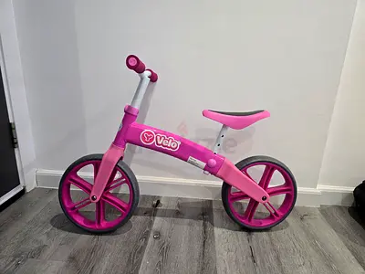 Pink Velo balance bike — lightweight toddler training bike