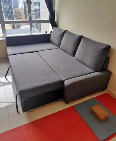 Grey L-shaped sofa bed - converts to double bed, good condition
