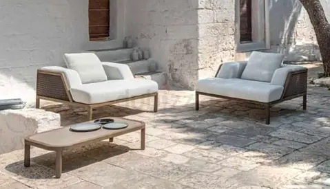 Outdoor rattan-style lounge set — 2-seater sofas with coffee table