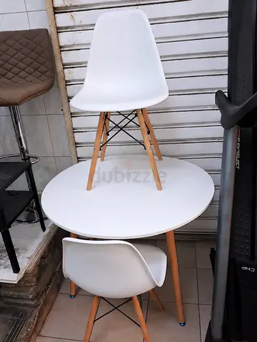 Small round dining table with two white modern chairs - good condition