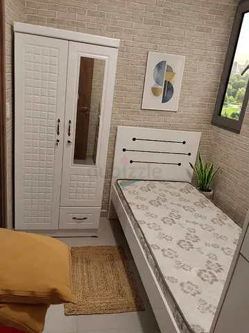 Single white bedroom set — bed with mattress and matching wardrobe