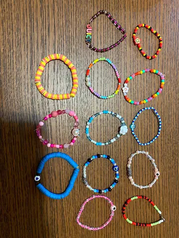 Lot of 14 colorful beaded stretch bracelets — assorted styles, good condition