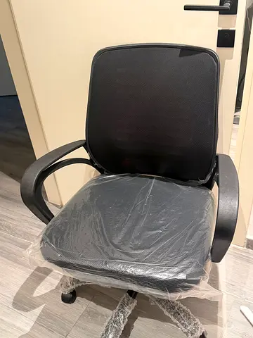 Black ergonomic office chair with armrests and wheels with study table brown in color good condition
