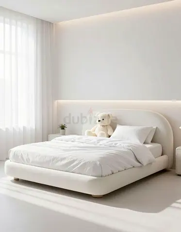Low-profile white upholstered double bed with headboard - good condition