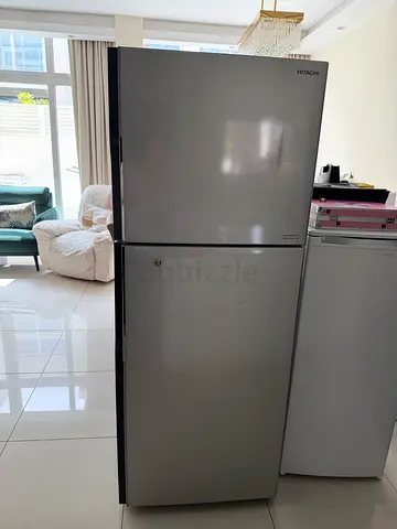 Silver double-door refrigerator in good condition