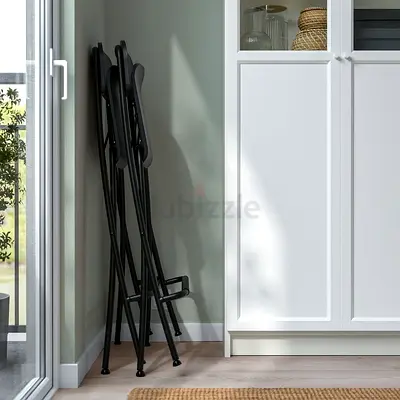4 Black Folding Metal Chairs - Compact, Like New