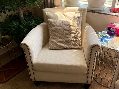 Comfortable Beige Accent Armchair with Stud Detailing