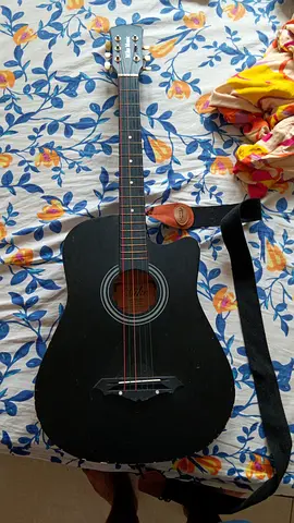 Black acoustic guitar with strap - used, playable condition