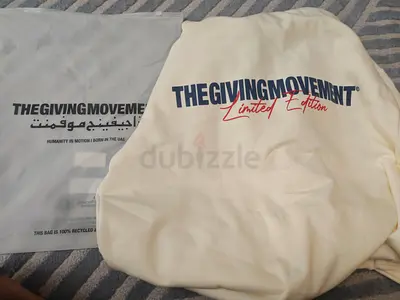 The Giving Movement Cream hoodie with front pocket, brand new XL, limited edition