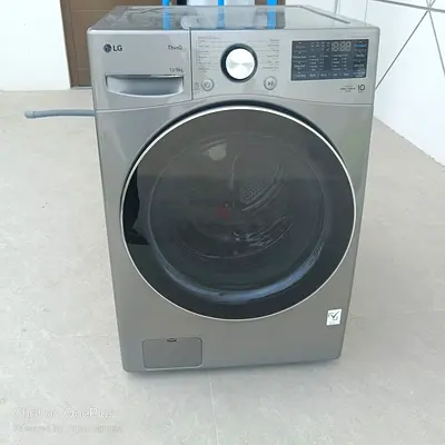LG 13/8 kg Front Load Washer Dryer in a silver/platinum finish with AI DD, TurboWash, and ThinQ