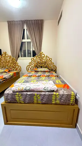 2 Single wooden gold bed with ornate headboard — good condition and negotiable price