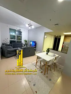 Luxury apartment, second occupancy. Two bedrooms, living room, and open balcony. Ajman City Tower. F