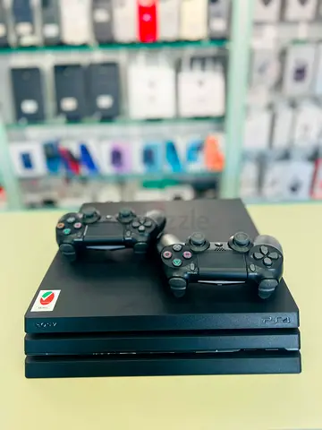 Sony PlayStation 4 Pro with 2 DualShock 4 Controllers - Good Condition