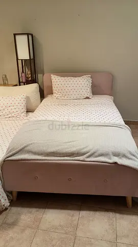 Single upholstered bed frame with headboard - light pink. Home center