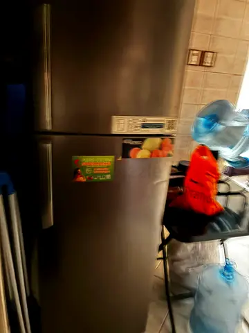 Used double-door stainless steel refrigerator - good working condition