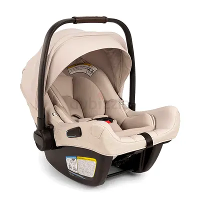Nuna Aire RX Beige Car Seat + Base - Good Condition - Travel Bag Included