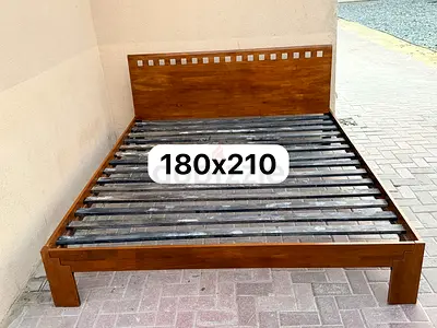 Solid wood king bed available in good condition